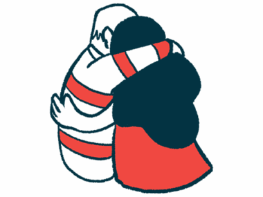 Two people with their arms around each other are shown from behind.