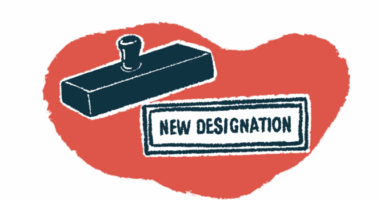 A rubber stamp is seen hovering over the stamped words 'new designation.'