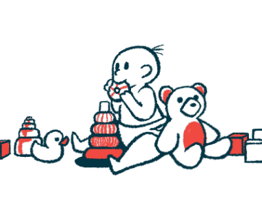 A baby mouths a toy while surrounded by other toys.