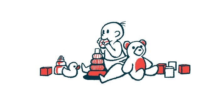 A baby mouths a toy while surrounded by other toys.