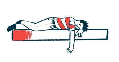 A person lies prone on a surface with one arm hanging down.