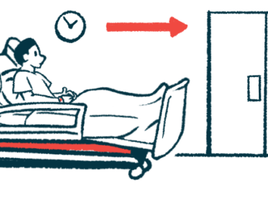 A man reclines in a hospital bed outside of a room.