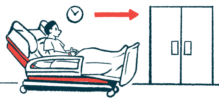 A man reclines in a hospital bed outside of a room.